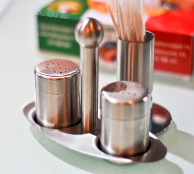 Salt-pepper and toothpicks set in stainless steel clipart