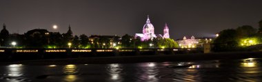 Night view to Isar river and the church behind it, Munich, Germany clipart