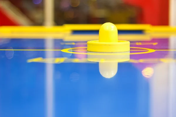 Yellow air hockey mallet — Stock Photo, Image