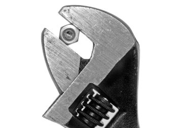 Adjustable wrench with a firm grip on a nut and bolt