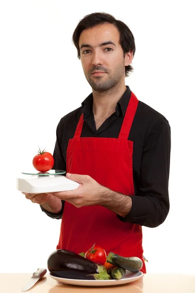 Шеф-кухар томатним масштабу — стокове фото
