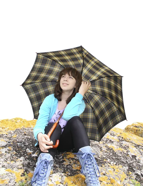 The romantic girl under an umbrella on a stone — Stock Photo, Image