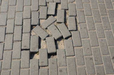 Small tiled sidewalk without few ones. clipart