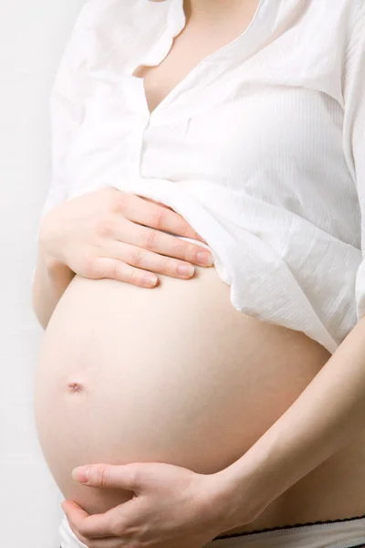 Gravid kvinna mage Stockbild