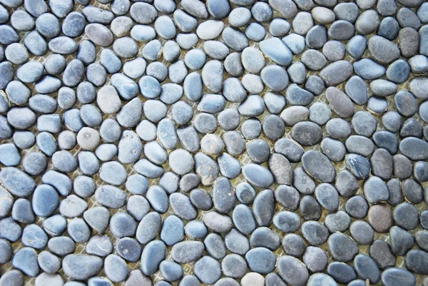 Black pebble stones texture — Stock Photo, Image