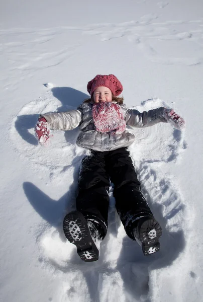 A girl on snow — Stock Photo, Image