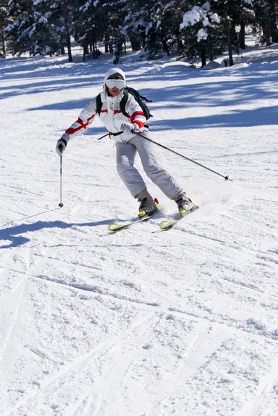 Beautiful skier skiing on the slope — Stock Photo, Image