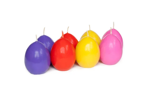 stock image Easter candles in the shape of eggs on the white background