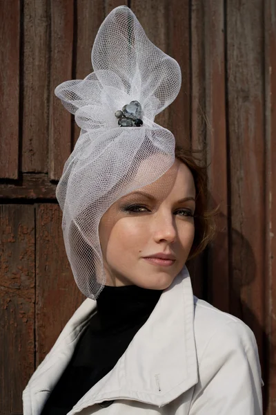 Woman in a glamorous white hat — Stock Photo, Image