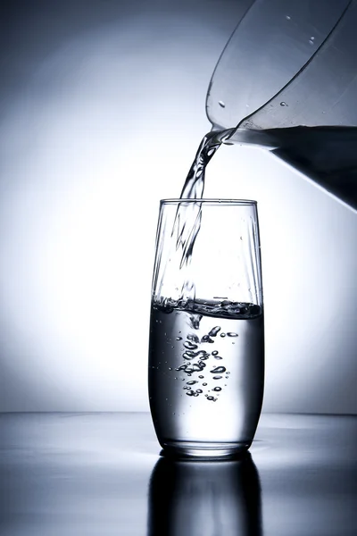 Pouring water into a glass. — Stock Photo, Image