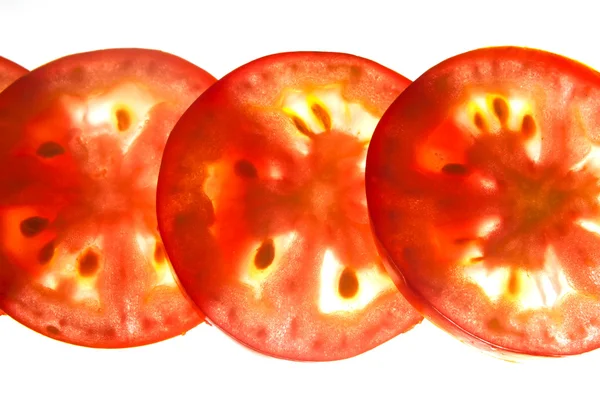 Backlit tomato slices — Stock Photo, Image