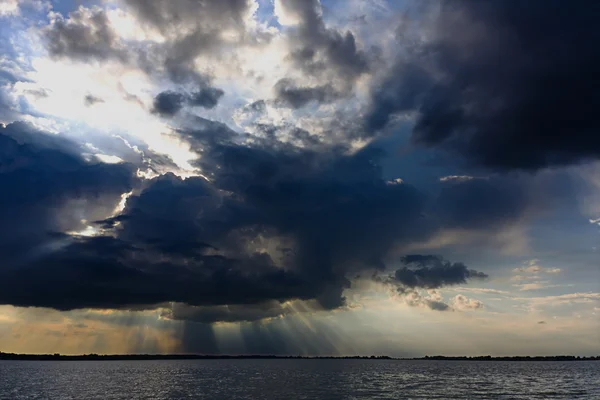stock image Crepuscular rays over the Tisza lake