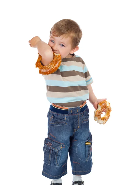 Little boy with two bagels — Stock Photo, Image