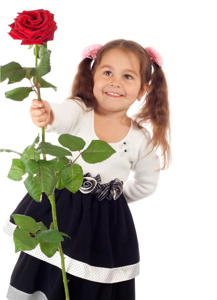 Bambina con rosa rossa — Foto Stock