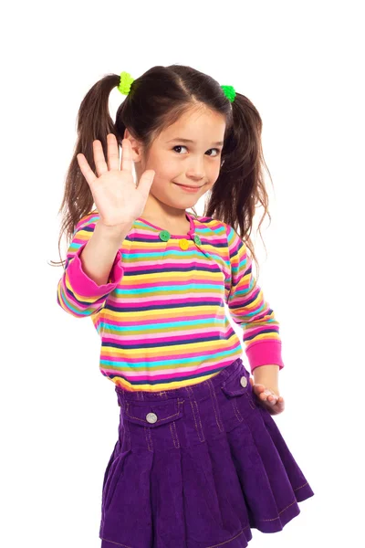 Lächelndes kleines Mädchen zeigt die Hand nach oben — Stockfoto