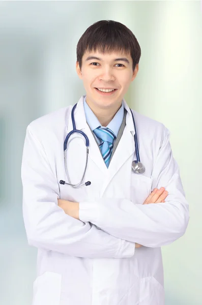 De man de arts op een witte achtergrond — Stockfoto