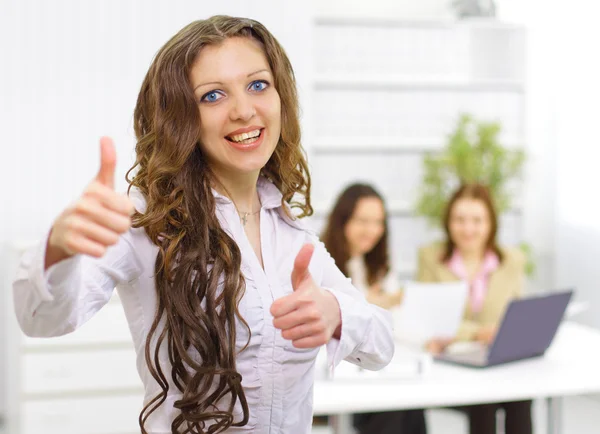 The beautiful business woman with a team on a back background — Stock Photo, Image
