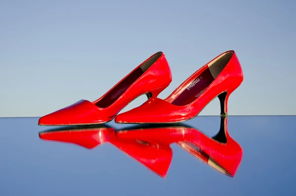 stock image A pair of stiletto on mirror