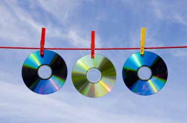 Three dvd and cd disks and sky clipart