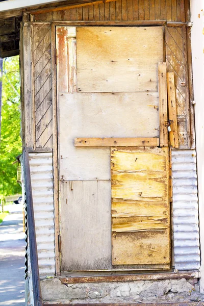 stock image Old shaky wooden door