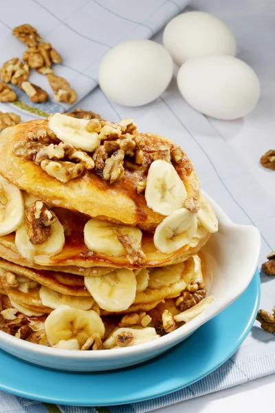 Pancake stack with slices of banana and walnuts — Stock Photo, Image