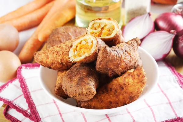 Fried cakes stuffed with carrot — Stock Photo, Image