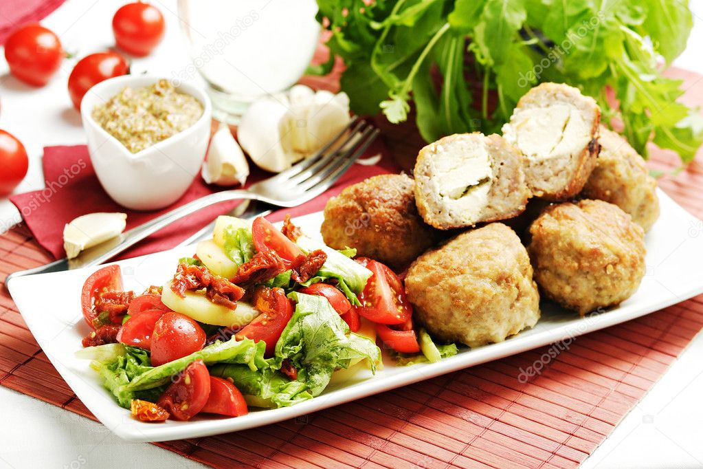 Meatballs with salad garnish