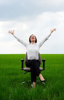 Happy businesswoman sitting on recliner clipart