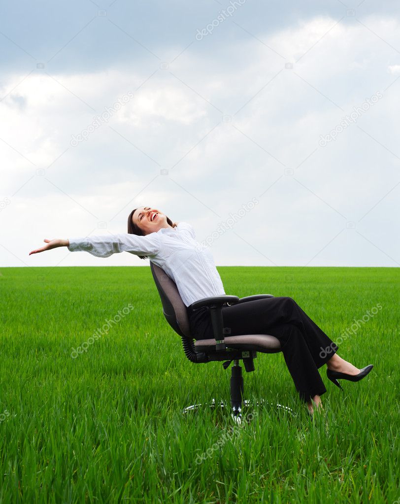 Businesswoman resting on chair