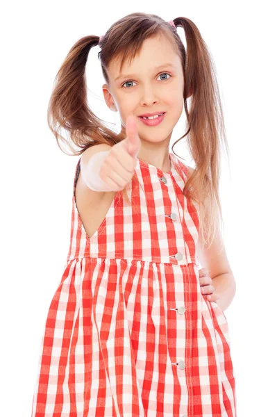 Smiley girl showing thumbs up — Zdjęcie stockowe