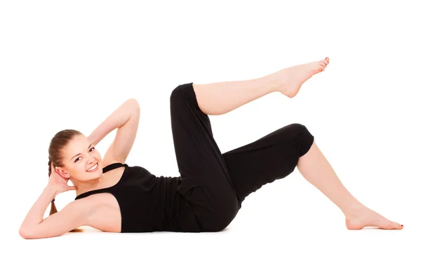 Mulher sorridente fazendo exercícios — Fotografia de Stock