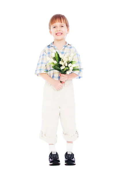 Мальчик держит кучу тюльпанов — стоковое фото