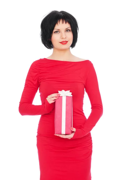 Woman in red dress holding gift — Stock Photo, Image