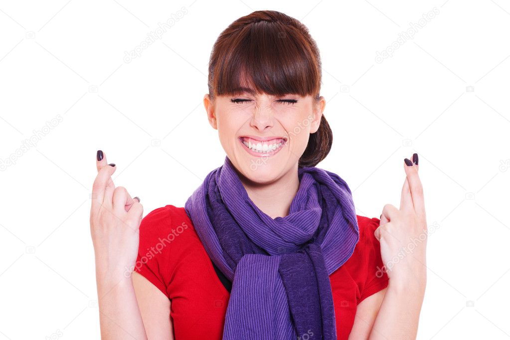 Smiley woman with fingers crossed