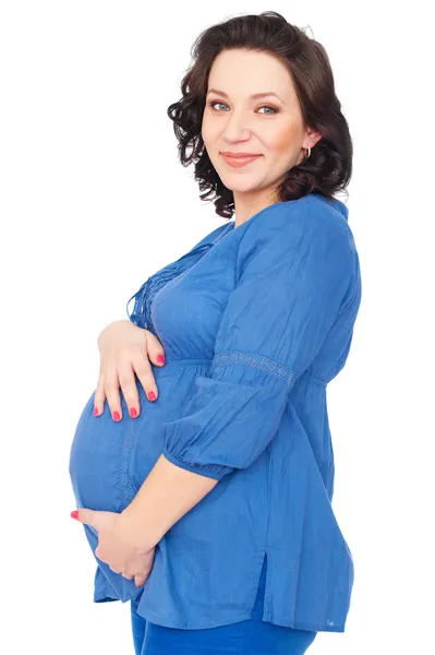 Беременная женщина обнимает животик — стоковое фото