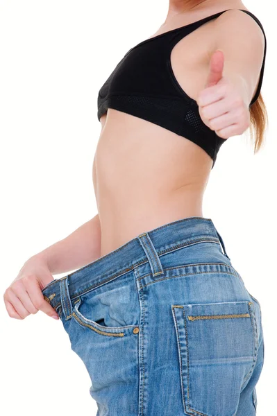Mulher magra em jeans grandes — Fotografia de Stock