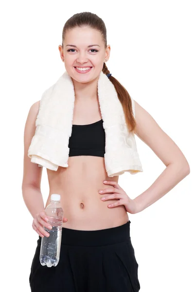 Ung idrottskvinna med handduk och vatten — Stockfoto
