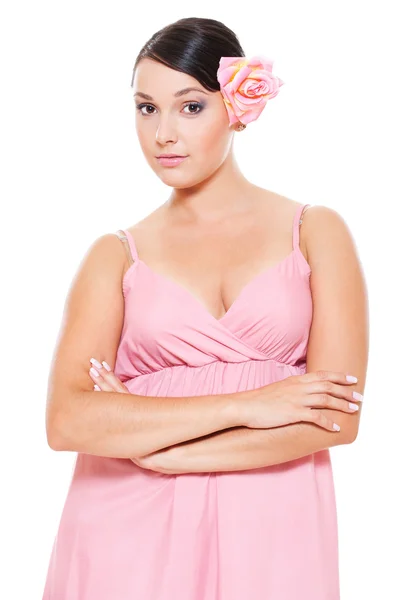 Beautiful woman with pink rose in hair — Stock Photo, Image