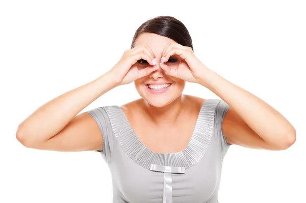 Woman looking through imaginary binocular — Stock Photo, Image