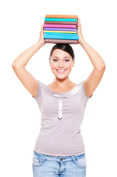 Modell håller böcker på hennes huvud — Stockfoto