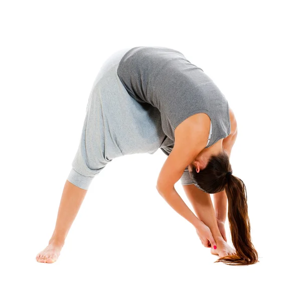 Sporty woman doing flexibility exercise — Stok fotoğraf