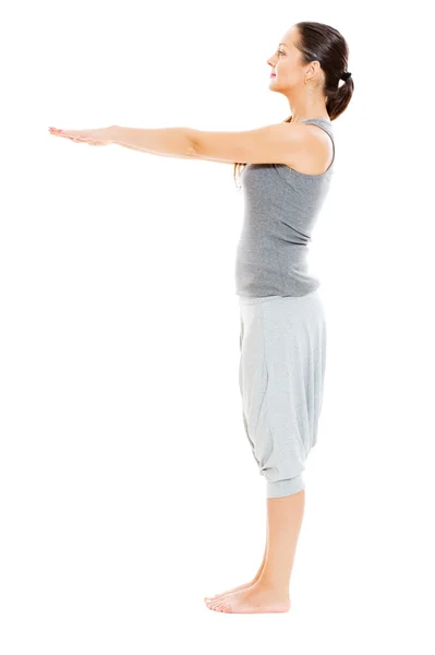 Young woman doing physical exercise — Stock Photo, Image