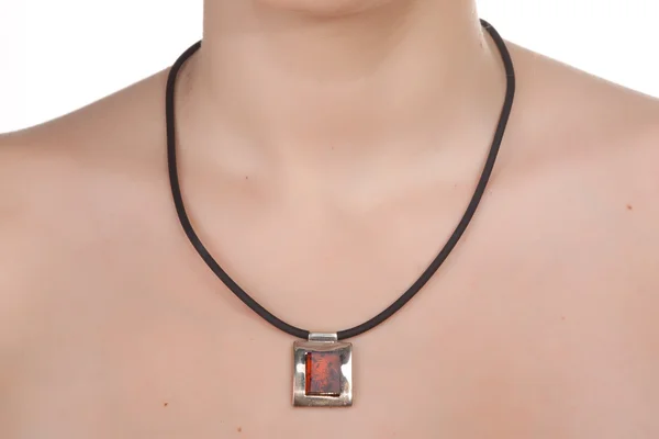Amber jewelry on female neck. — Stock Photo, Image