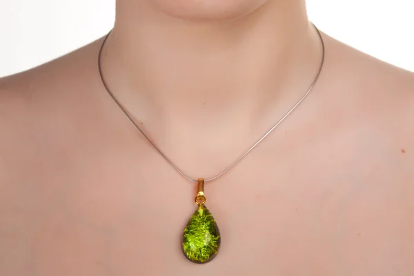 Amber jewelry on female neck. — Stock Photo, Image