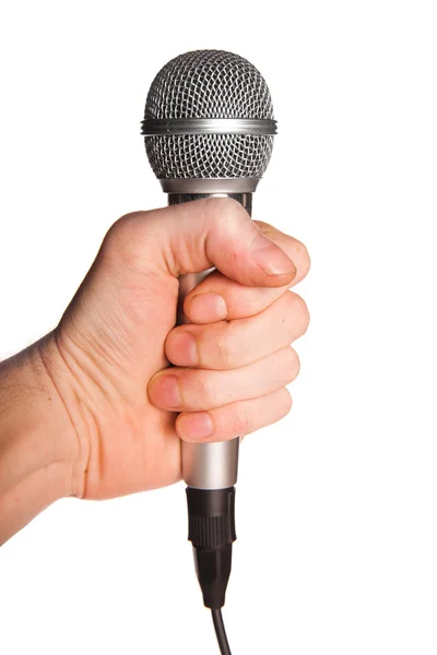 La mano del hombre sosteniendo un micrófono — Foto de Stock