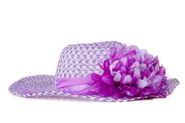 Vrouwen paars hoed met een bloem. — Stockfoto