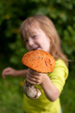 Child gives a mashroom clipart