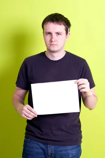 stock image Man holding a blank paper.