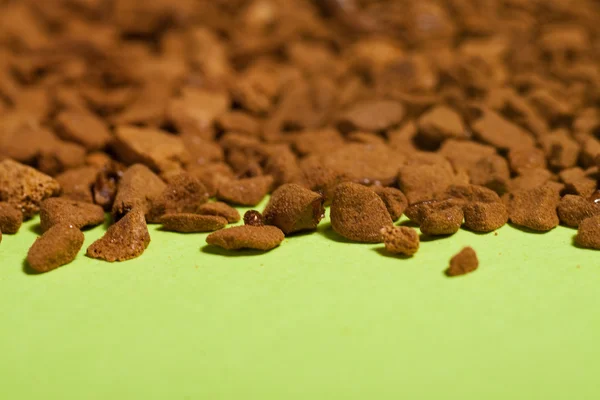 Instant coffee on the green paper. — Stock Photo, Image