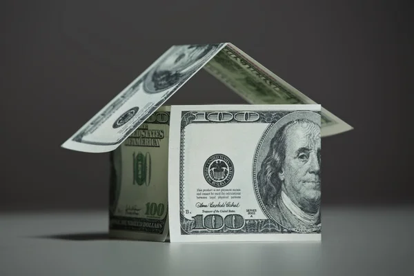 stock image House of dollars on a gray background